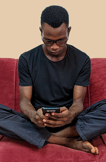 receding hairline man afro hair type working stressed concentrating phone