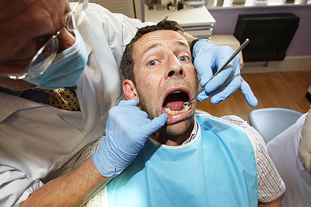 Man in dentist chair The Belgravia Centre