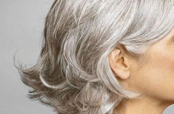 Hair can turn grey at a young age. Causes of greying hair include genetics, genetic diseases and autoimmune diseases.