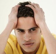 Young man worried about hair loss